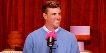 Craig Conover speaking into a pink microphone on Hayu Presents