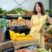 Melissa Leong stands in a fresh produce market for Healthy, Wealthy and Wise on Channel 10.