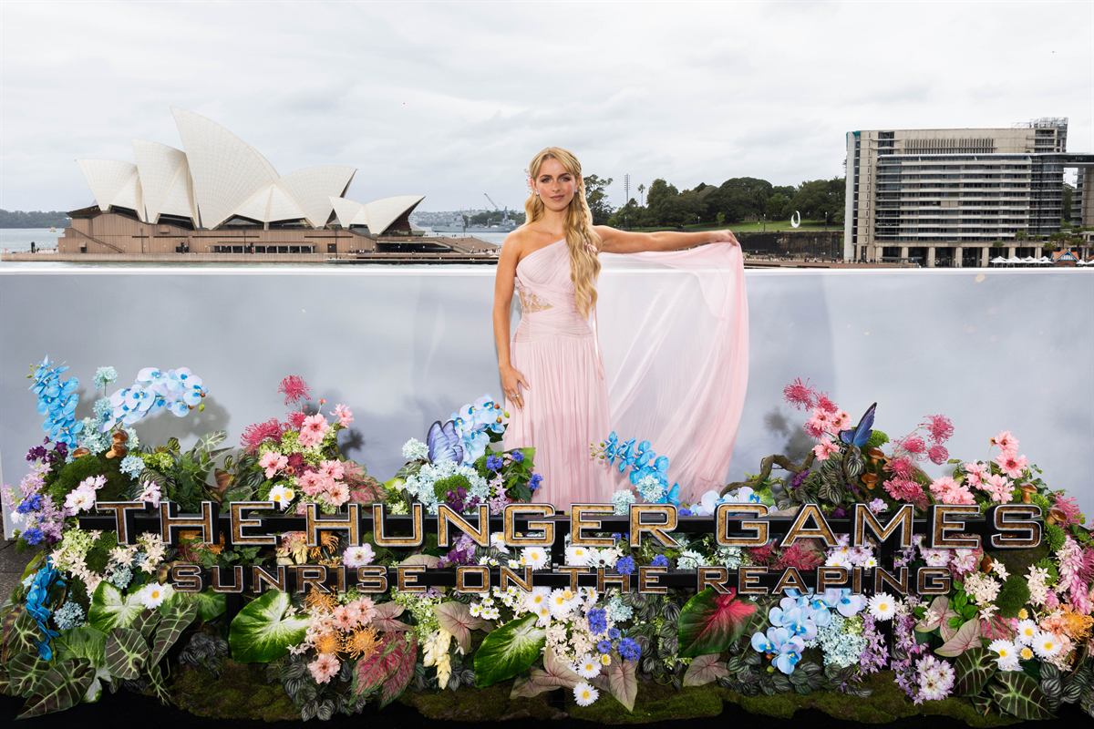 Mckenna Grace poses by Sydney Harbour with the Opera House behind her