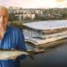 Rick Stein holding a fish in front of the new Sydney Fish Market