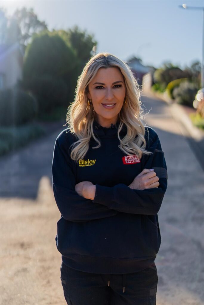 Jess Eva in Budget Battlers workwear