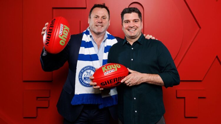 David King and Leigh Montagna hold Kayo Sports footballs ahead of the 2027 AFL season.