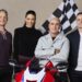 10's MotoGP commentary team Cameron Donald, Tara Rushton, Daryl Beattie and Sam Charlwood with a Honda motorcycle and chequered flag
