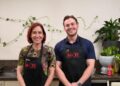 Sheridan and Ted in their MKR aprons in the kitchen of their Perth Instant Restaurant