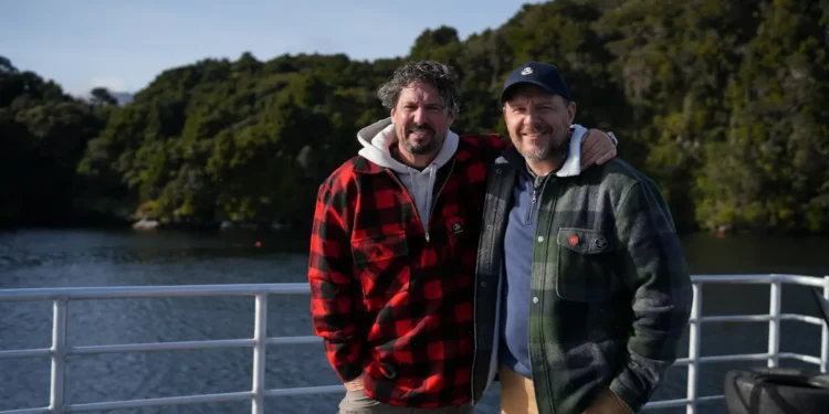 Colin Fassnidge and Manu Feildel together aboard a boat