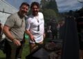 Colin Fassnidge and Manu Feildel cooking at an outdoor grill in Off the Grid on Channel 7