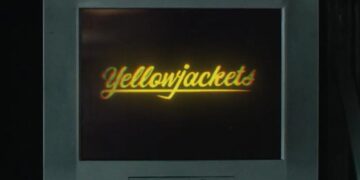 Yellowjackets season four title on a television screen