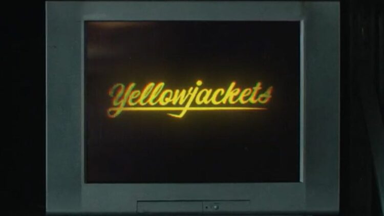 Yellowjackets season four title on a television screen