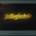 Yellowjackets season four title on a television screen