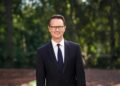 Peter Rice in an official portrait outdoors