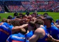 Newcastle Knights players gather in a team huddle