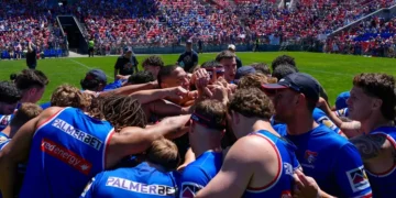 Newcastle Knights players gather in a team huddle