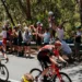 Cyclists riding past spectators at the Santos Tour Down Under