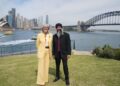 Governor-General Sam Mostyn and Sukhdeep Singh Bhogal standing beside Sydney Harbour