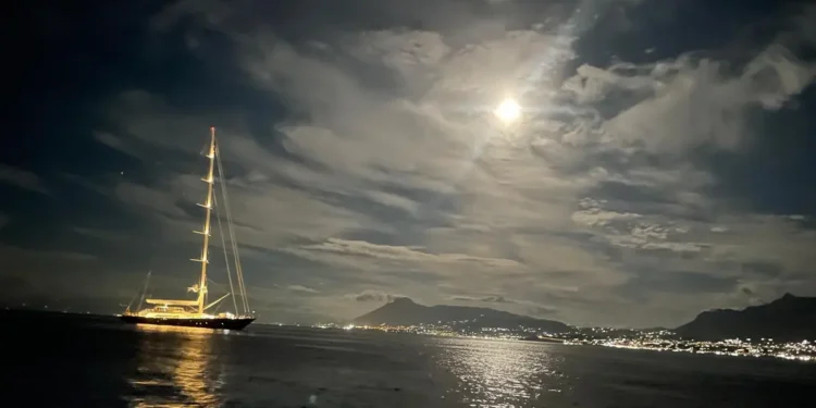 A yacht under storm clouds at sea