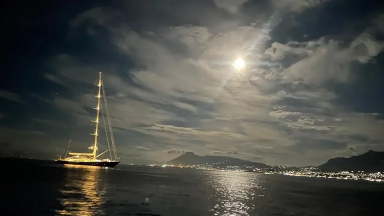 A yacht under storm clouds at sea