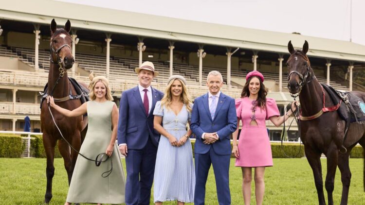 Seven's spring racing presenters with two horses at a racecourse