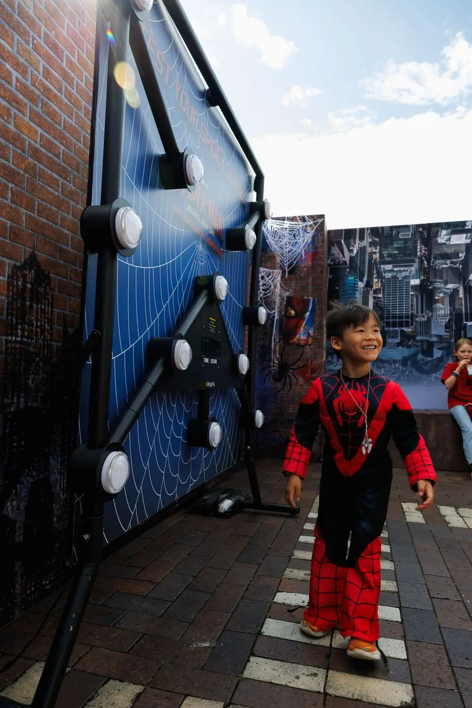Child in a Spider-Man costume at the Spidey-senses game in Sydney