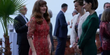 Characters gather at a social event in A Taste For Murder episode three