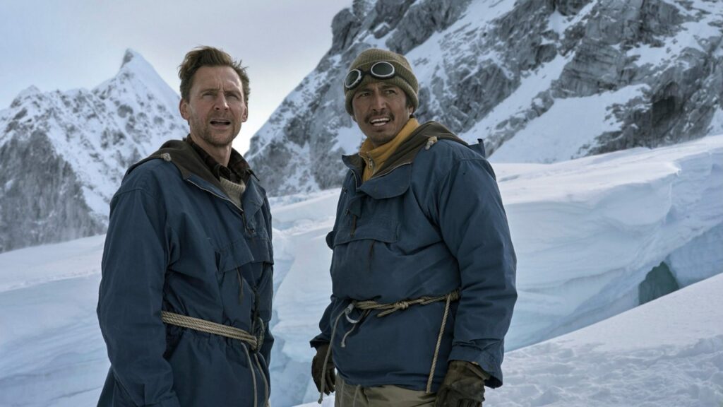Tom Hiddleston and Genden Phuntsok in snow-covered mountains in Tenzing