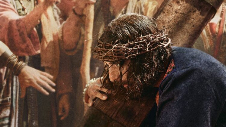 Jonathan Roumie as Jesus carrying the cross in The Chosen season 6 artwork