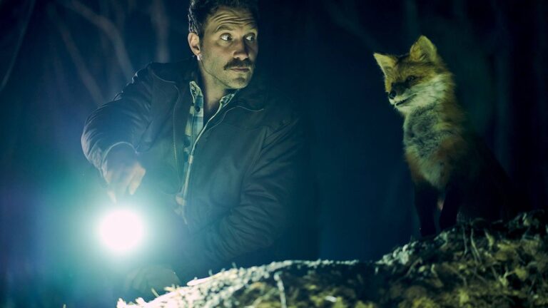 Jai Courtney beside the fox in an official still from The Fox