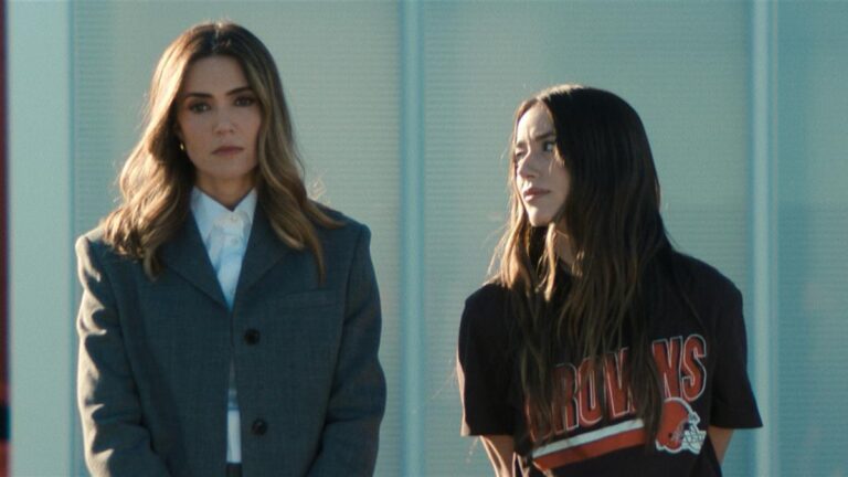 Two characters in Disney+ drama The Land stand together, one wearing a Cleveland Browns shirt