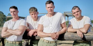 Four Marine recruits in white t-shirts and dog tags at a training course in The Mosquito Bowl on Netflix