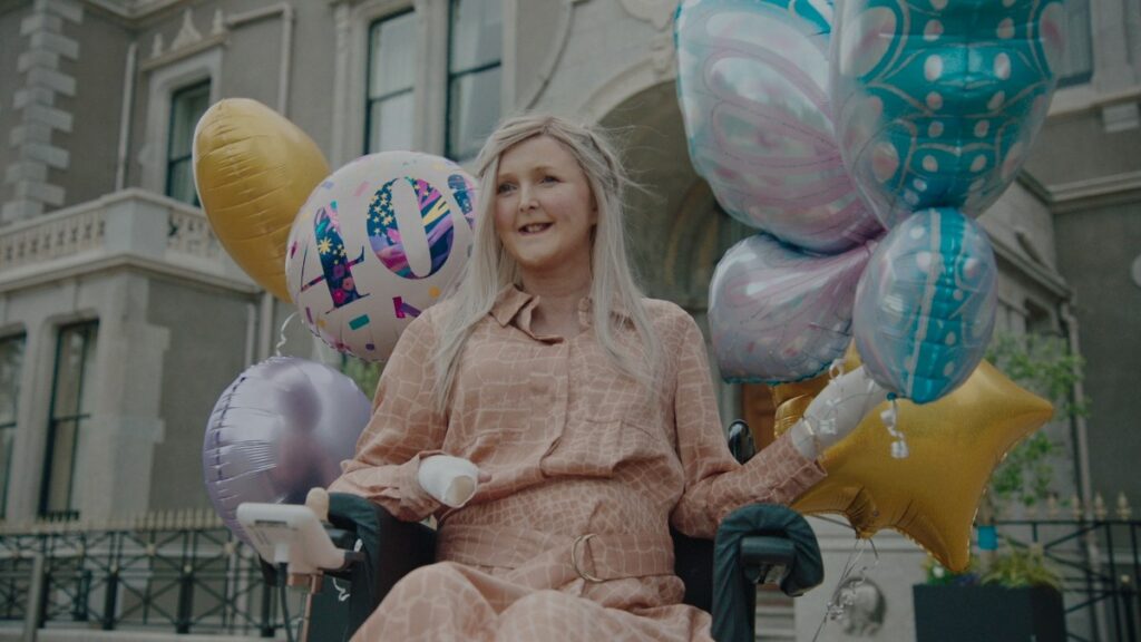 Emma Fogarty surrounded by balloons in the HBO documentary