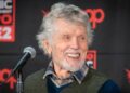 Actor Tom Skerritt smiling during a panel at C2E2 in Chicago in 2024