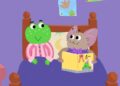 Tralala the green frog and a bat character in the animated children's series Tralala
