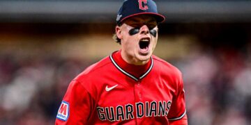 Australian baseball player Travis Bazzana celebrates in a Cleveland Guardians uniform